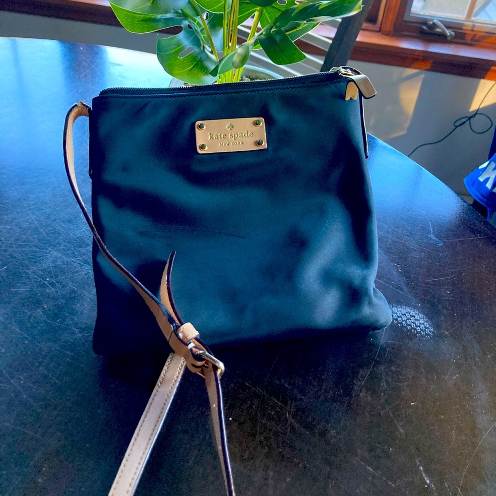 Kate Spade. Black. Crossbody. Tan strap.